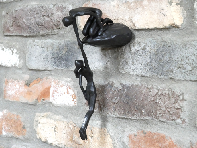 Man Lifting Wall Decoration