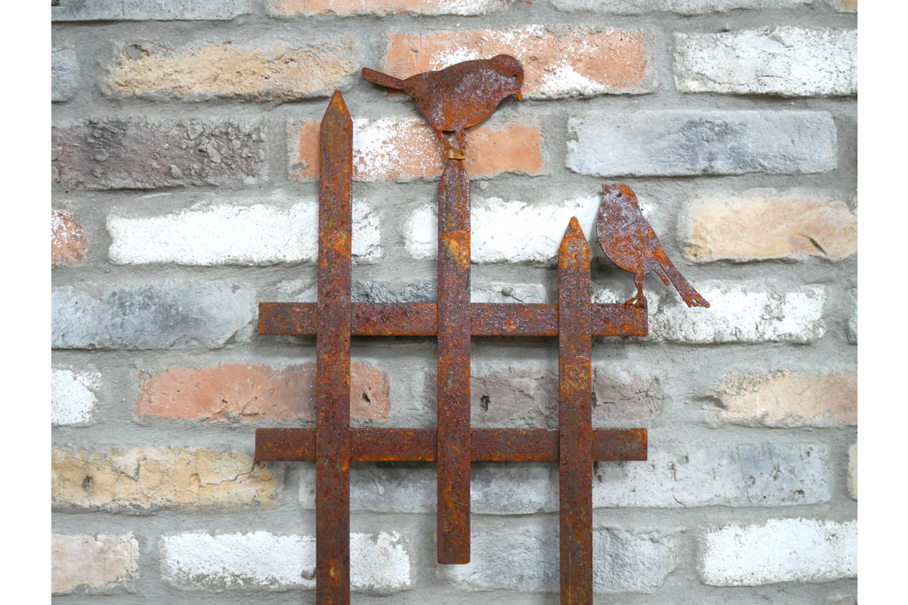 Rusty Fence With Birds Stake