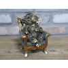 Highland Cow On A Chair