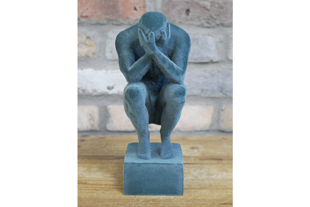 Man With Head In Hands